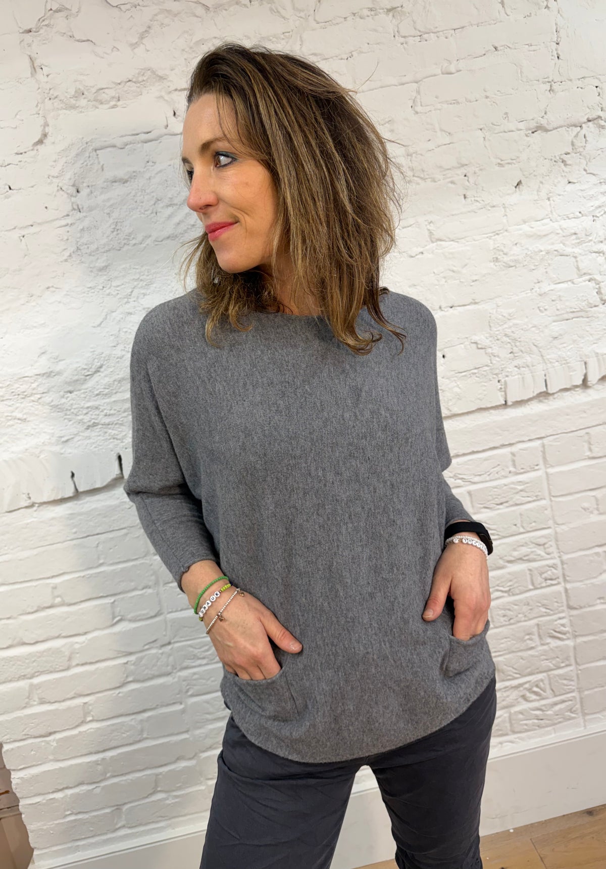 Suéter de murciélago con dos bolsillos