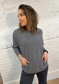 Suéter de murciélago con dos bolsillos